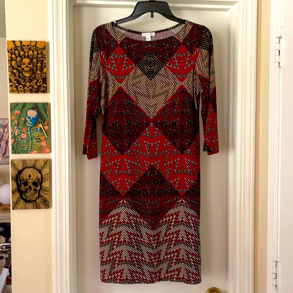 Beautiful pullover geometric design polyester and spandex dress. Never worn